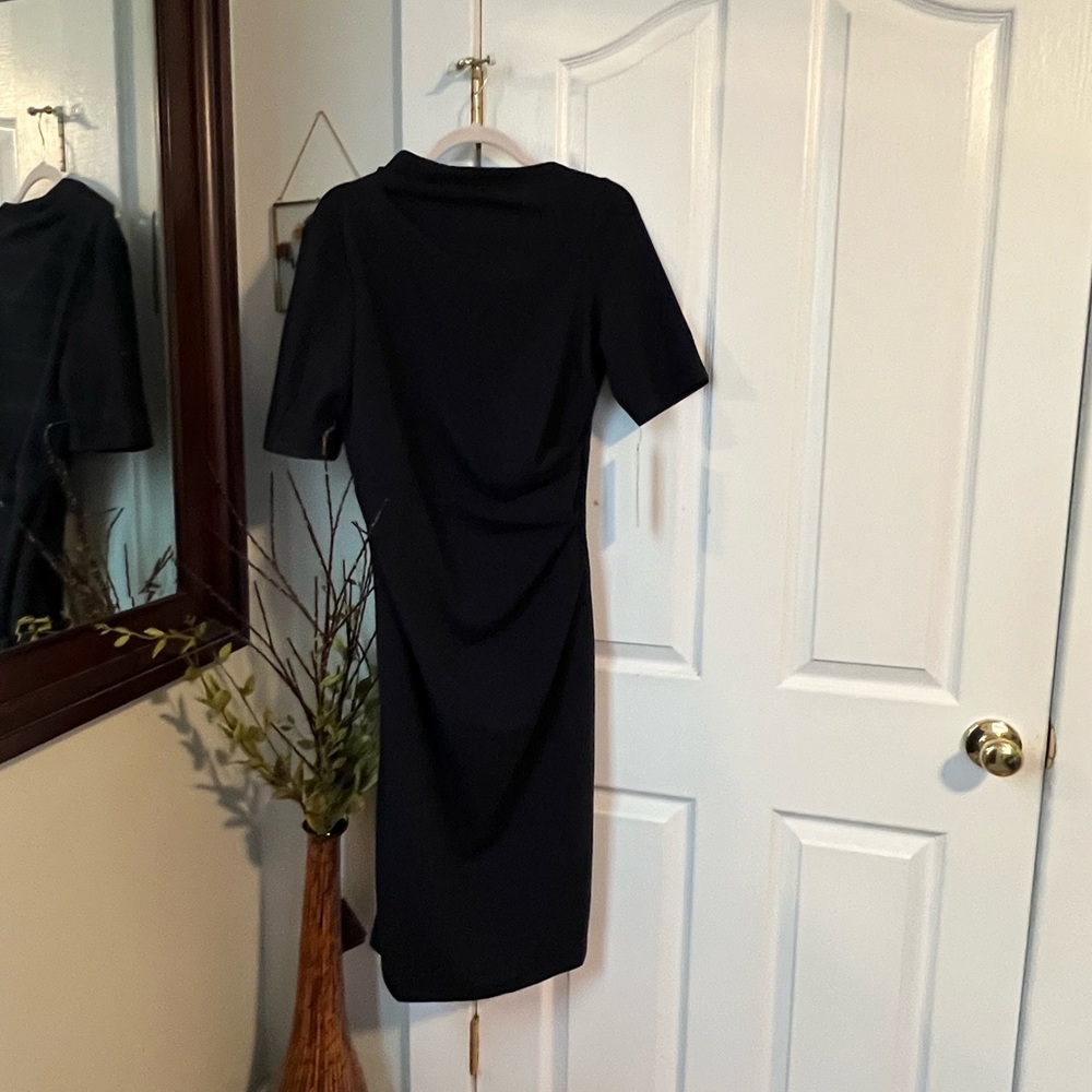 Beautiful elegant Maggie London dress, NWT too small for me. Dark navy.